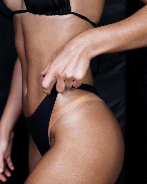Bikini line showing the natural contrast between untanned skin and the AMBREA glow